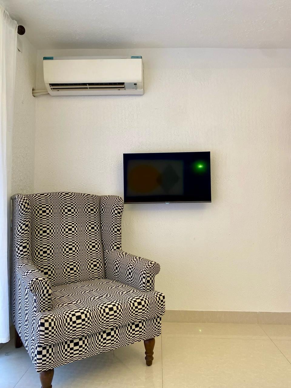Graphic black-and-white art wall in the Bandra Art House living room