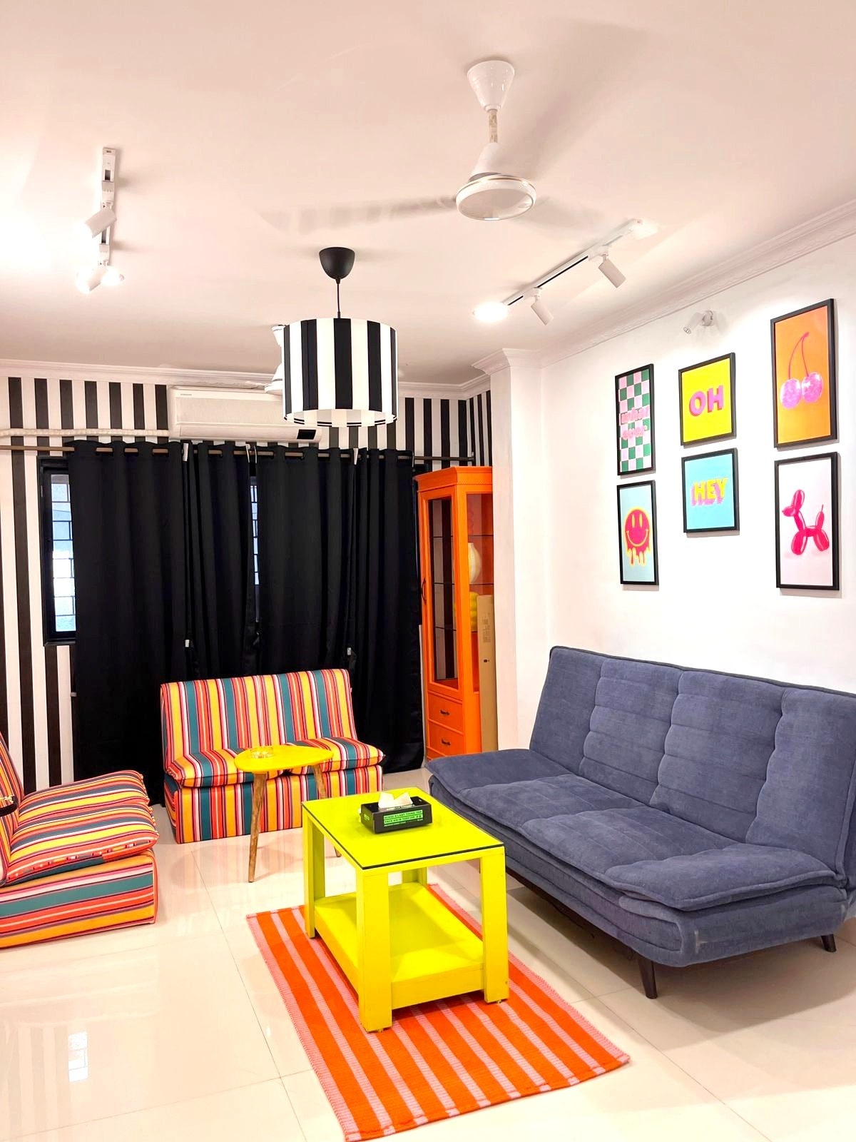 Colourful objects styled across an Ikona Pop shelf