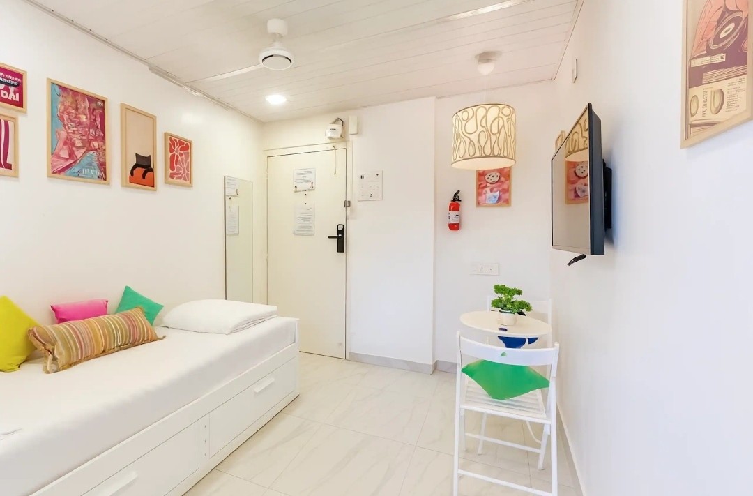 Bright white shell and compact furniture in the Little Bandra Studio