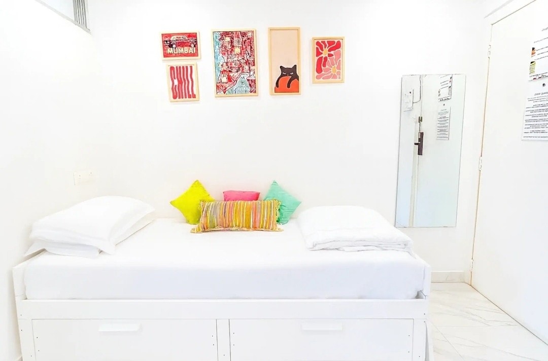 Small colourful art on the wall of the Little Bandra Studio